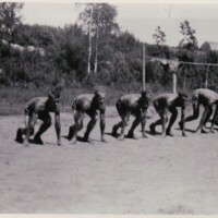 Athletes crouched ready to start a race in Intola, Ontario